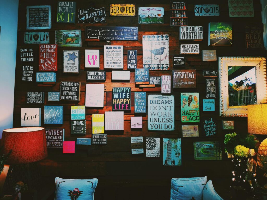 A warm and inviting indoor space with motivational quotes displayed on a wooden wall.